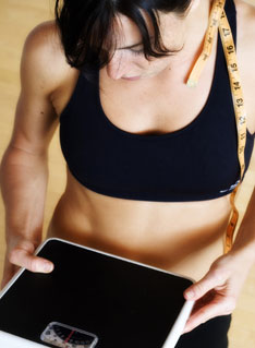 Woman Holding Scale